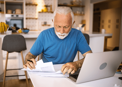 Man working on financial paperwork
